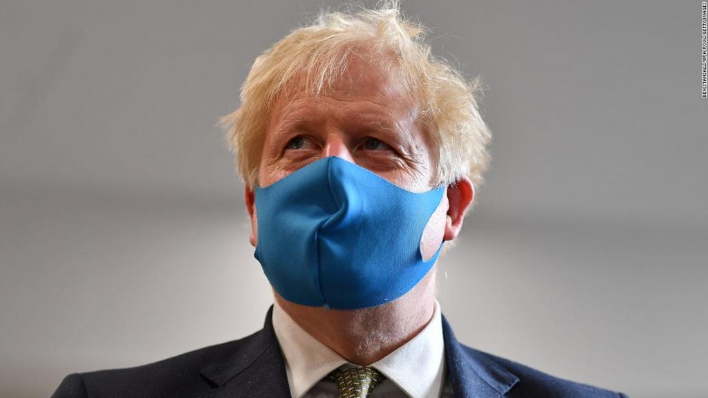 UK Prime Minister Boris Johnson wears a face mask as he visits Tollgate Medical Centre in London on July 24, 2020.