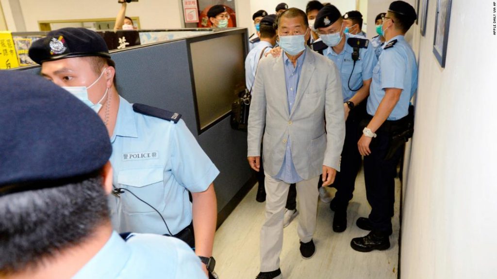 Police lead Hong kong pro-democracy media mogul Jimmy Lai (C), 72, away from his home after he was arrested under the new national security law in Hong kong on August 10, 2020.